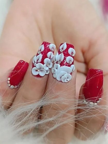 Another view of the stunning red and white 3D floral nails, showcasing the dimension and sparkle.