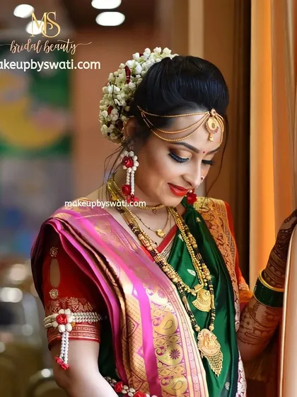 The complete traditional look for Shweta's baby shower. I created a classic Marathi look with a neat floral bun, defined eyes, and traditional jewelry placement.