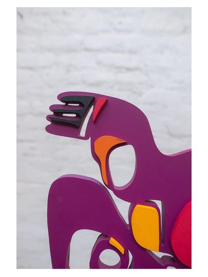 A detail shot of one of the abstract MS backrests from the 'Kaleidochaos' swing, showcasing its vibrant purple and orange color palette.