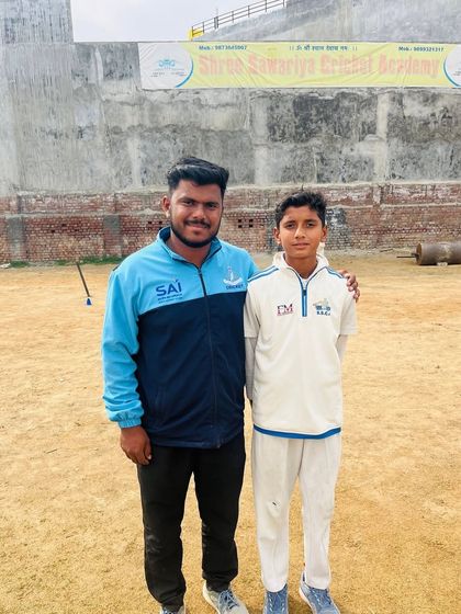 Roshan with his coach after another 5-wicket haul.
