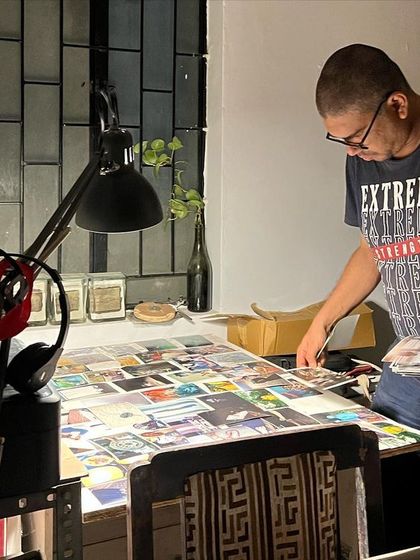 The solitary work of an artist is nurtured here. This photo shows the late-night process of reviewing prints and planning for a new book project.