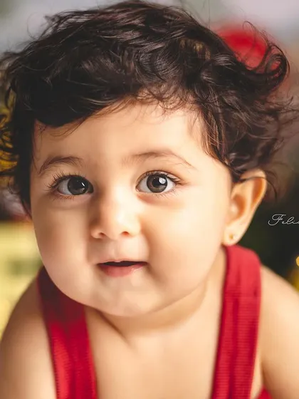 A close-up portrait from a Winnie the Pooh themed first birthday. Those big, beautiful eyes and sweet expression are just priceless.