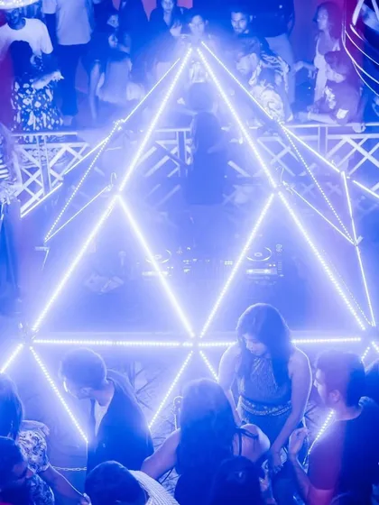 An overhead shot of the pyramid lighting structure at The Fixx Bar, with the crowd dancing below. It's a truly unique and immersive setup.