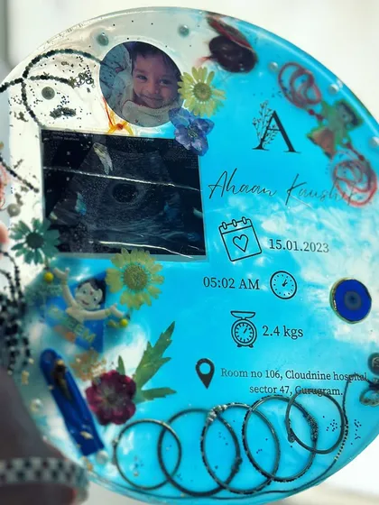 This custom baby details frame holds so much love. I preserved this little one's sonogram, first photo, birth details, and even their tiny silver bangles in a beautiful resin keepsake for the family to treasure.