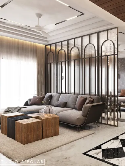 In this South City residence, we used a sleek glass partition with fluted details and arched tops to separate the formal living room from a more casual lounge. This maintains an open feel while clearly defining the two zones.