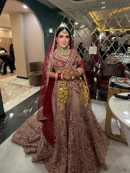 Another full-length shot showing the bride's complete look. The lighting in our salon is perfect for seeing every detail of the makeup before the main event.