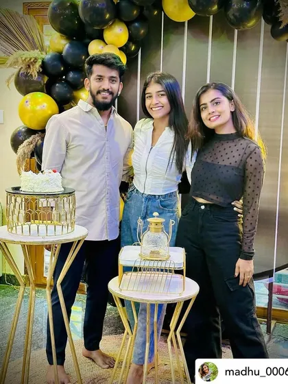 Friends enjoying the stylish black and gold birthday party.