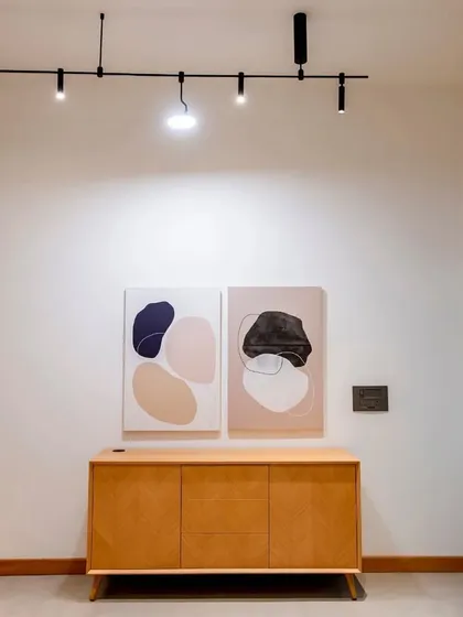 Another view of the zen office, where our magnetic track system highlights artwork. The ability to precisely aim each spotlight ensures that the art becomes a focal point, adding color and texture to the minimalist space without visual distraction from the fixture itself.