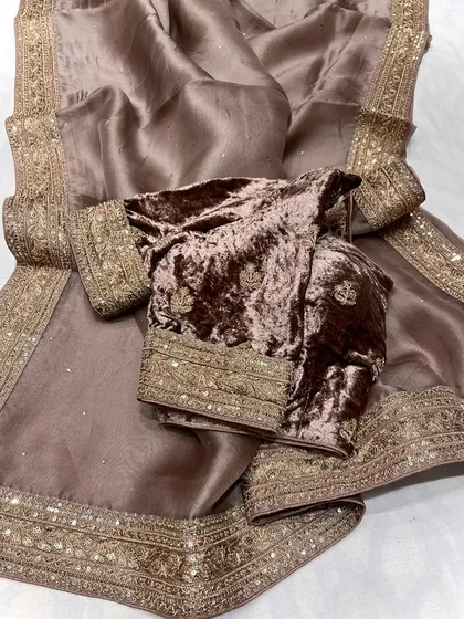A look at my Sabyasachi-inspired collection. These sets feature pure organza sarees with detailed borders, paired with luxurious velvet designer blouses. They are available in a range of beautiful colors like brown, navy, green, black, yellow, purple, and off-white.