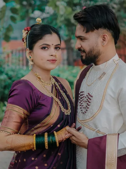 A powerful portrait with the bride looking directly at the camera while the groom looks at her. This creates a compelling dynamic, showcasing her confidence and his admiration.