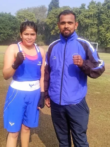 I stand with one of our champions, Simran Maurya, after her gold medal win at the 2024 Delhi Olympic Games. We train both male and female boxers to compete and win at the highest levels.