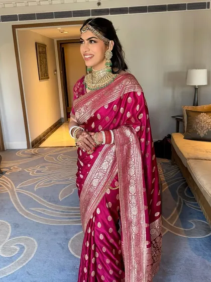 The picture of newlywed bliss. Varda's soft, rosy makeup and glowing skin create a look of pure happiness and effortless grace.
