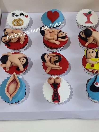A collection of assorted naughty and adult-themed cupcakes, perfect for a bachelorette or bachelor party.