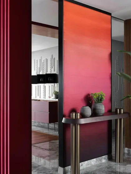 Another view of the dramatic foyer, showing the transition into the main living space.