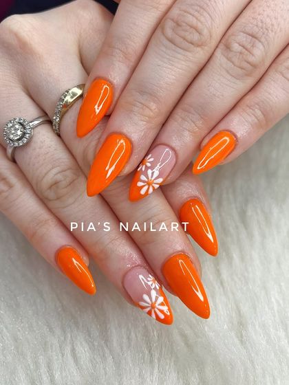 A pop of orange with cute, hand-painted daisy accents. This is a perfect example of a fun and cheerful design.