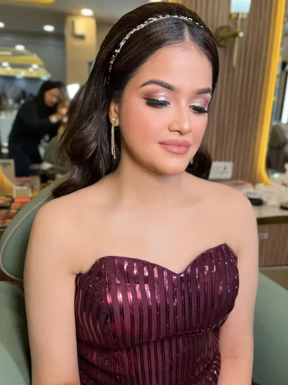 Eyes closed to show the beautiful, soft eyeshadow. It's a versatile look that works for any occasion.