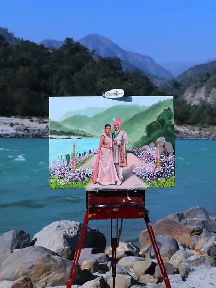 We painted this beautiful couple against the serene backdrop of the Ganga in Rishikesh. A destination wedding painting becomes a timeless memory of the place you said "I do".