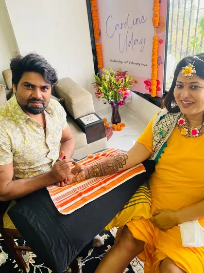 Applying mehandi for a client at her haldi ceremony. Our team is experienced in working at all kinds of wedding events.