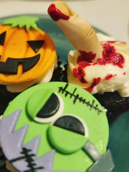 Even our treats are dressed for the occasion. These spooky and delicious cupcakes, with jack-o'-lanterns and Frankenstein toppers, are always a favorite at our Halloween parties.