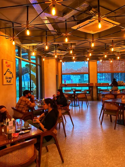 The warm and inviting interior of our cafe, a perfect place to escape and relax.