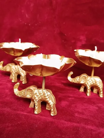 A set of elephant urli candle holders, a unique decorative item for festive occasions.