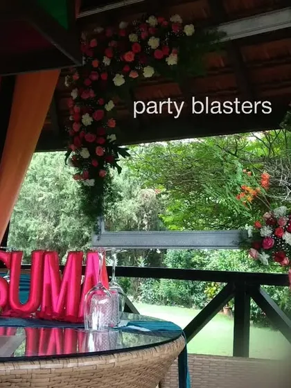 A personalized touch for the surprise party, with foil balloons spelling out the birthday person's name on the main table.