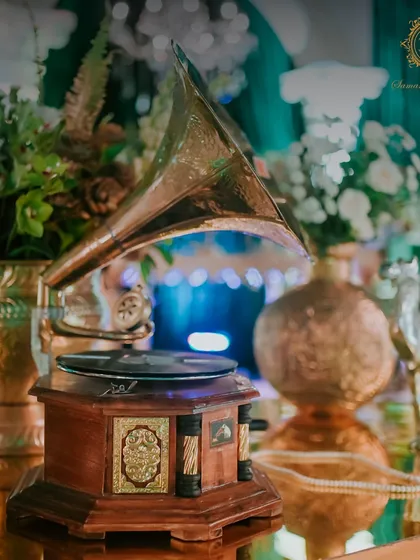 A classic gramophone sits as a centerpiece, a nod to timeless elegance and a conversation starter that adds a unique, personal touch to the decor.