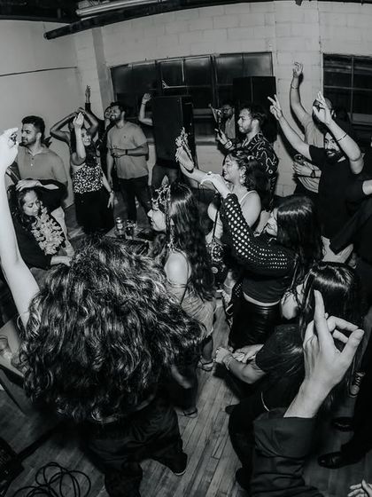 Hands up at the Toronto Lush Loft. This black and white photo perfectly captures the raw, uninhibited joy of the night. My goal is to create these moments of collective release.