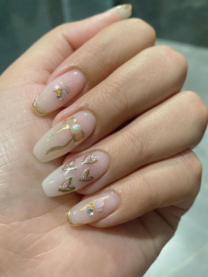 A little chrome love with these delicate gold chrome details over a milky white base.