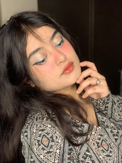 A close-up of the eye makeup for the anime look, showing the white liner and soft shimmer.