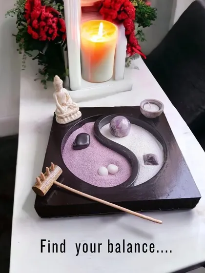 Find your balance with this desktop Zen garden. The Yin Yang design represents harmony, and raking the dual-colored sand around the amethyst crystal is a simple, meditative practice to center your thoughts.