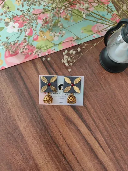 My gotapatti earrings are a festive favorite. These square fabric studs feature golden gotapatti work and a small jhumki drop, available in brown, green, and grey.