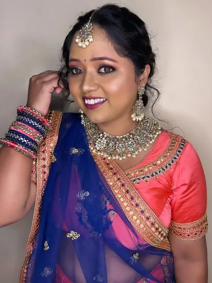 A confident pose from the bride. The makeup is designed to make her feel like the best version of herself.