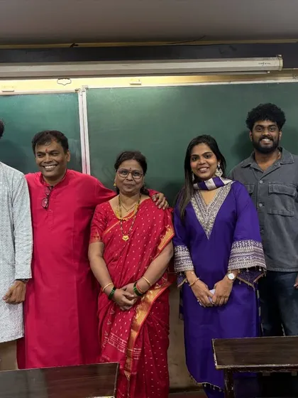 A group photo of our teachers and students after the Satyanarayan Pooja, capturing the family-like bond we share.