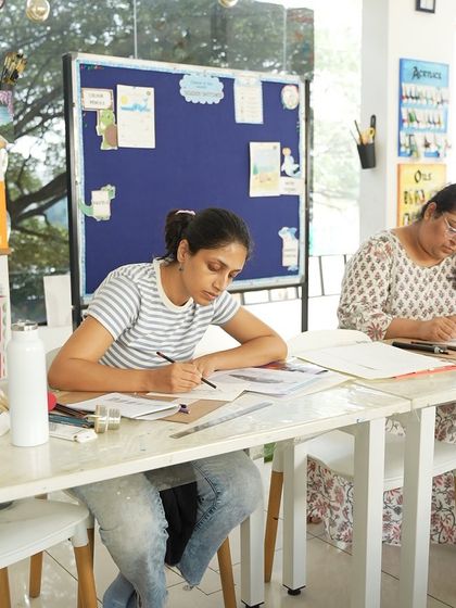 Our CFA course provides a dedicated and inspiring environment for students to hone their skills, like this student working on her sketch.