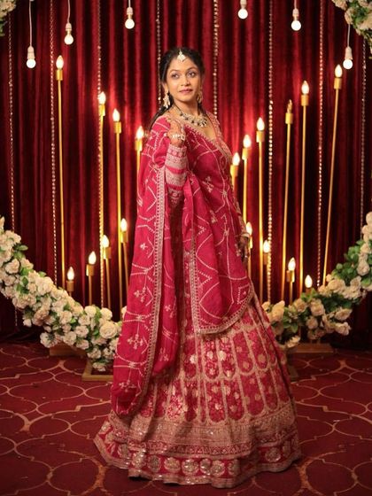 A full shot of the client in the pink lehenga, looking graceful and ready for the celebration.