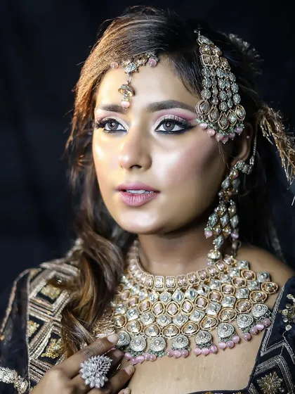 This portrait captures the elegance of a modern bride. The hairstyle is a simple yet chic half-updo, allowing the statement jewelry to shine.