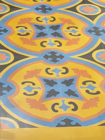Floors and patterns are one of our passions. This vibrant, colorful cement tile floor adds a playful and artistic touch to the space. The intricate design and bold colors create a joyful and energetic atmosphere.
