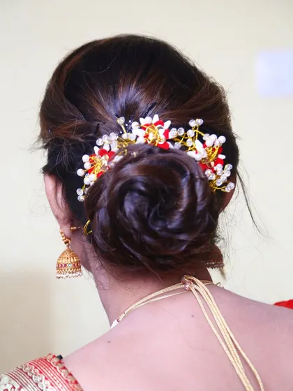 A perfect twisted bun made from the client's own hair. I added a decorative hairpiece to make it special for the occasion.