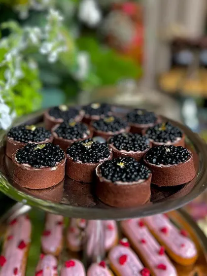 Our exquisite chocolate tarts topped with a generous layer of caviar and a touch of gold leaf, a truly decadent canapé.