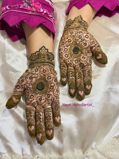 The full two-hand view of the mandala and heart design, a perfect blend of traditional and modern.