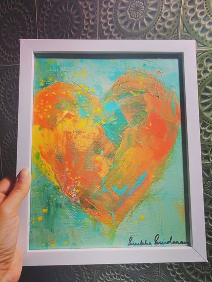 This heart has a warm, tropical feel, with oranges and yellows against a turquoise background. It’s a piece about overcoming challenges and finding the courage to be seen, like eating the proverbial frog.