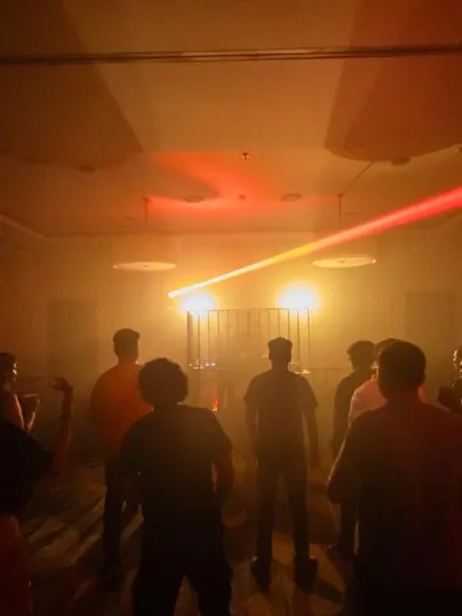 The crowd gathers in the atmospheric haze of The Park Ballroom, silhouetted against the stage lights. It's a space for connection and shared musical experience.