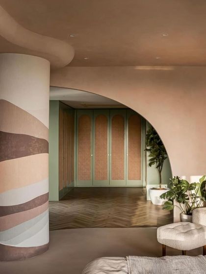 A view from the master bedroom into the walk-in closet, showcasing the use of color and texture, as featured by FOAID.