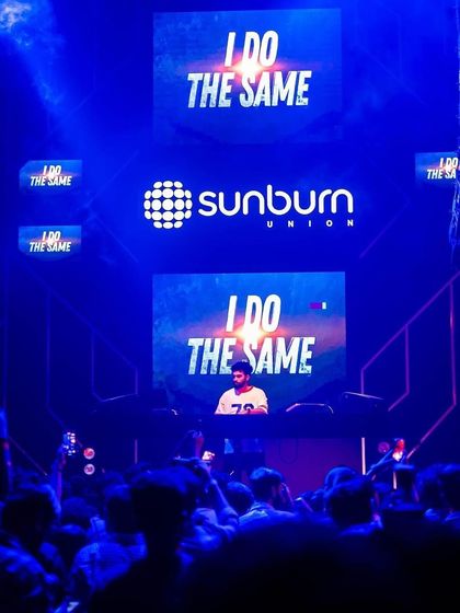 The massive LED screen at Sunburn Union displaying my visuals. This is a key part of how I tell a story with my music.