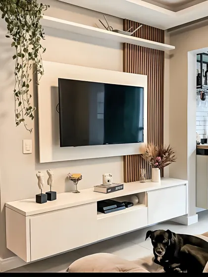 A minimalist floating TV unit in white, accented with a vertical wooden slat panel. This design is perfect for modern living rooms, offering a clean look while the top shelf and console provide space for decor and media devices.
