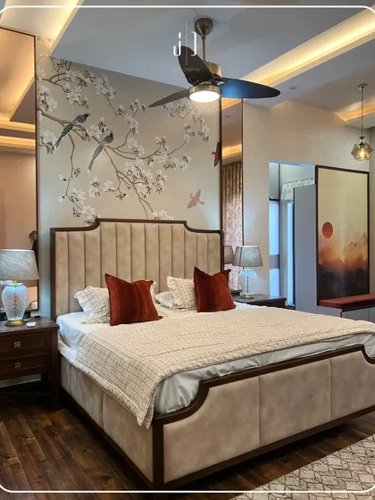 Your bedroom should be your personal sanctuary. For this master bedroom, I used a custom hand-painted wallpaper with a delicate bird motif to create a serene and artistic backdrop. Paired with a plush upholstered bed and warm wooden flooring, it’s a space designed for ultimate rest and relaxation.