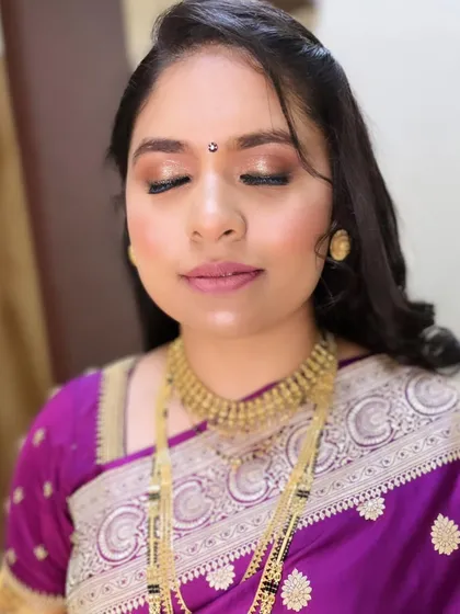 A detailed shot of the eye makeup for Radhika's reception look. The soft, shimmering tones enhance her eyes without being overpowering.