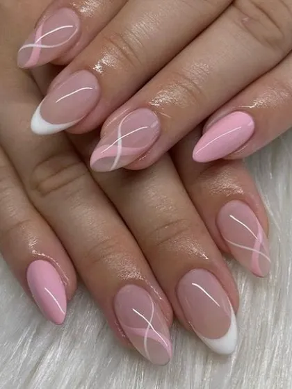 A pretty pink and white design with abstract lines and French tips.