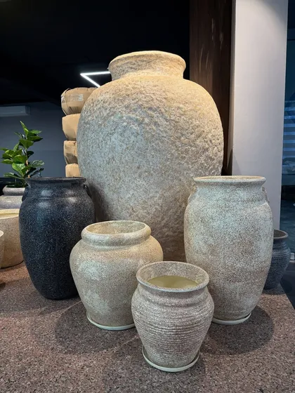 A collection of our rustic, stone-finish planters. These are great for adding an earthy, natural feel to your space.